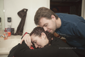 Husband leaning towards wife to comfort her.